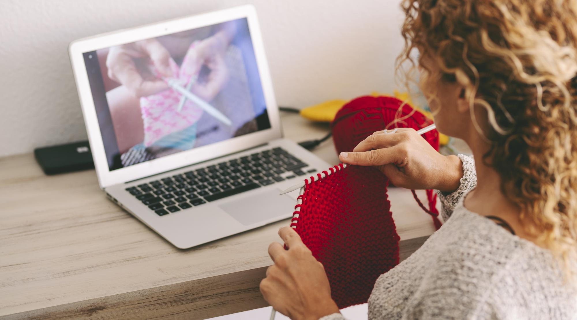 Instructor demonstrating embroidery technique